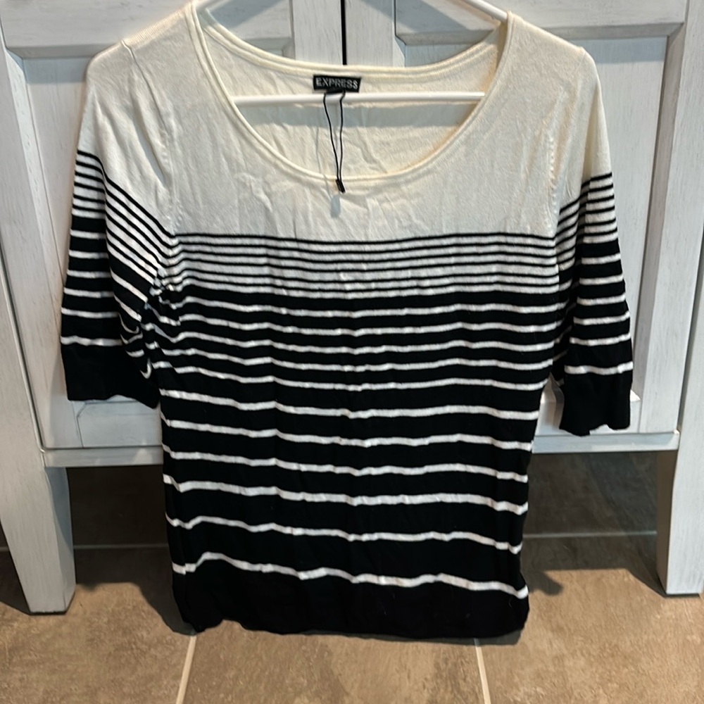 Express: Woman’s black/white striped short sleeved sweater. Great condition.